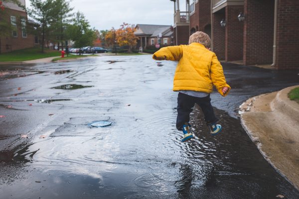 Kid Jumping in Puddle